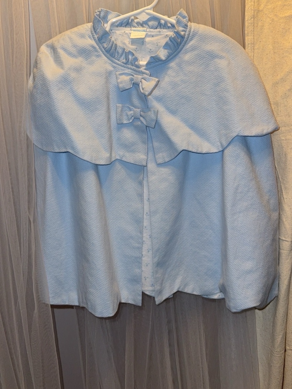 Girls size 6 Capelet jacket. Light blue.